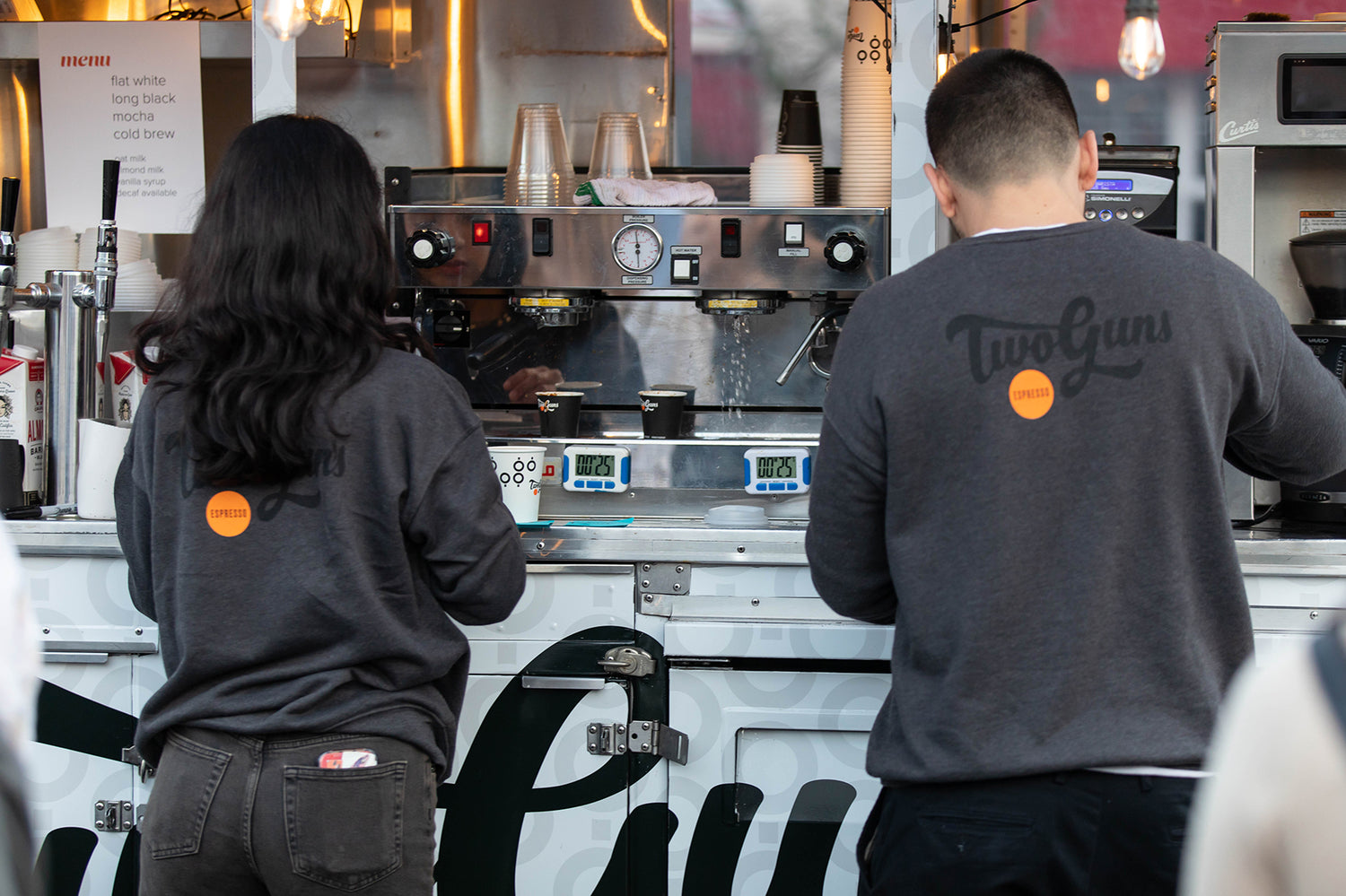 two baristas working on in espresso cart