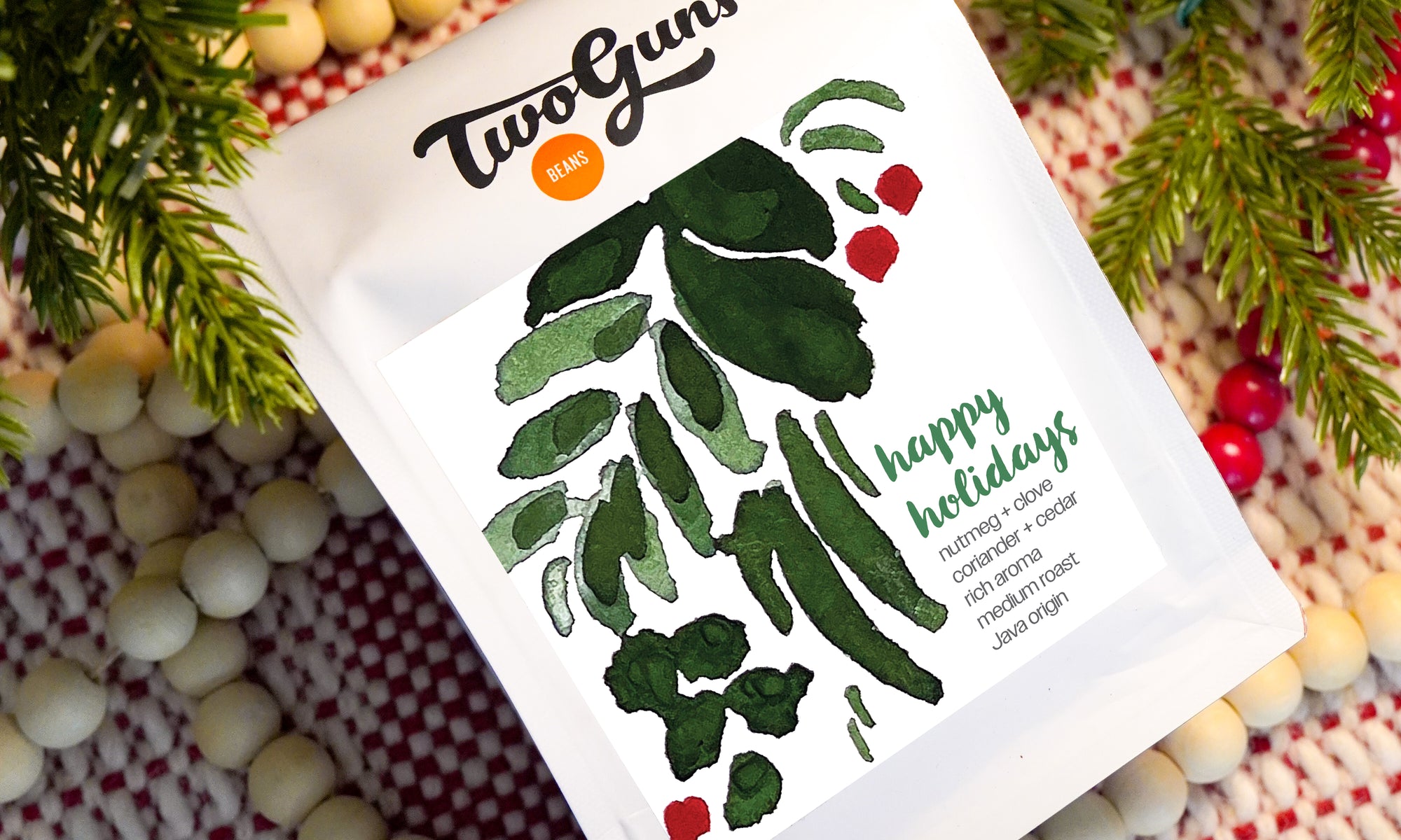 Image of Happy Holidays whole beans in 12oz bag on a christmas background