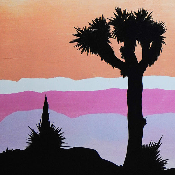 Sunset mural with joshua tree and plants in silhouette on an orange, pink, white and purple background