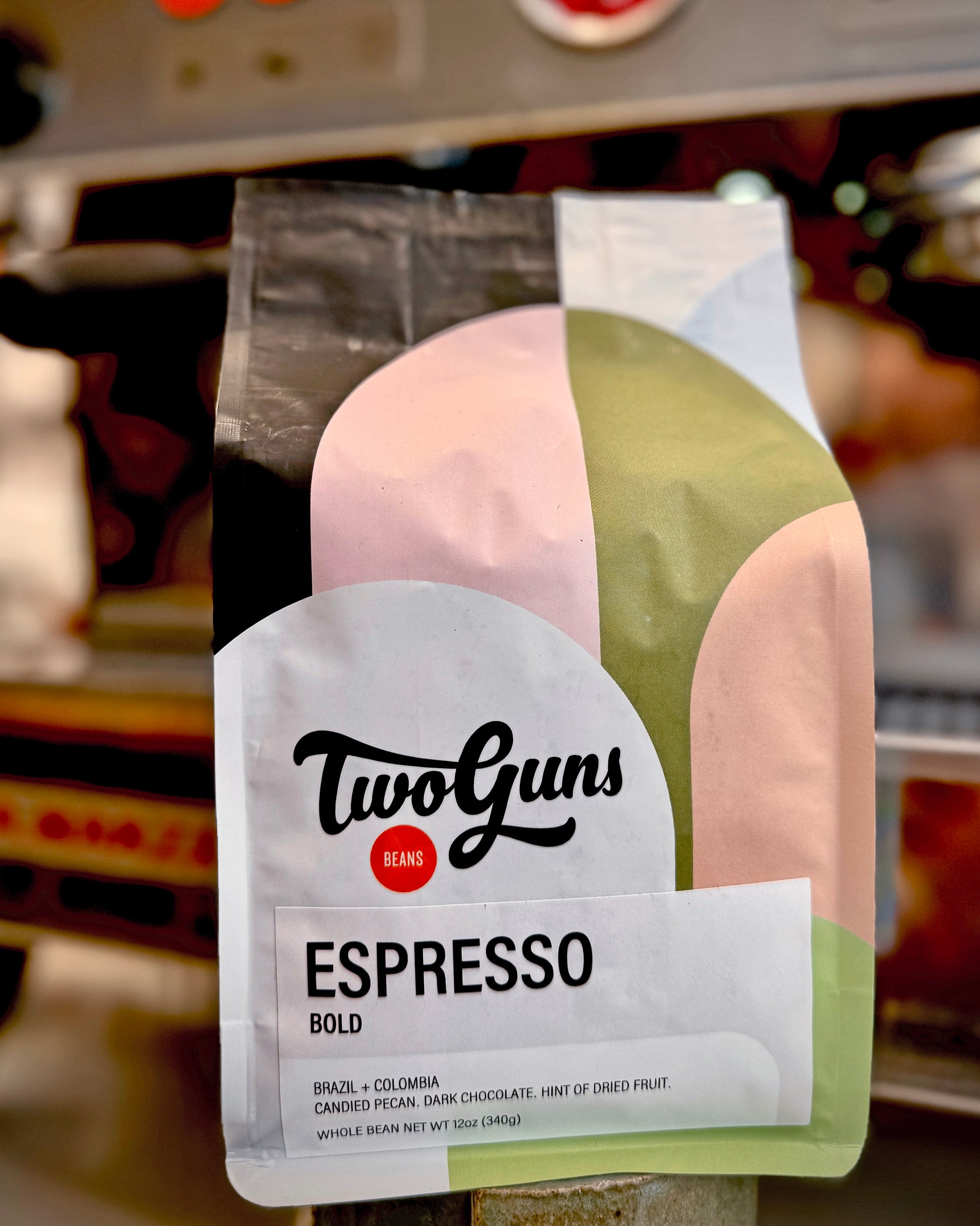 Two Guns Espresso Bold coffee package with a blurred store background